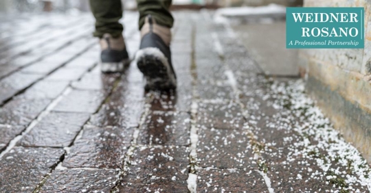 man walking on snowy path